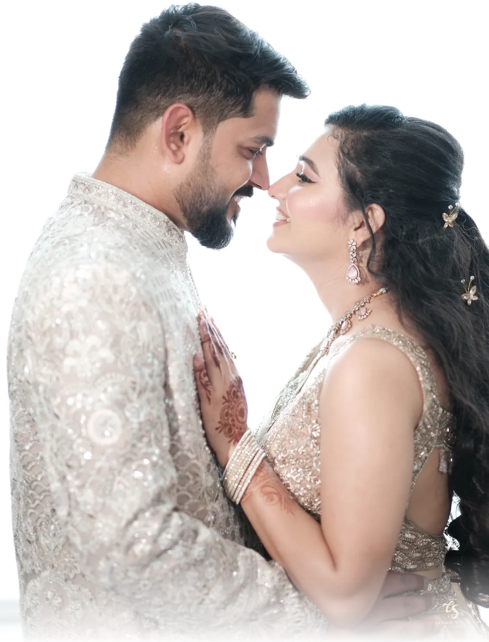 Nishtha and Akshay, forehead to forehead, smiling